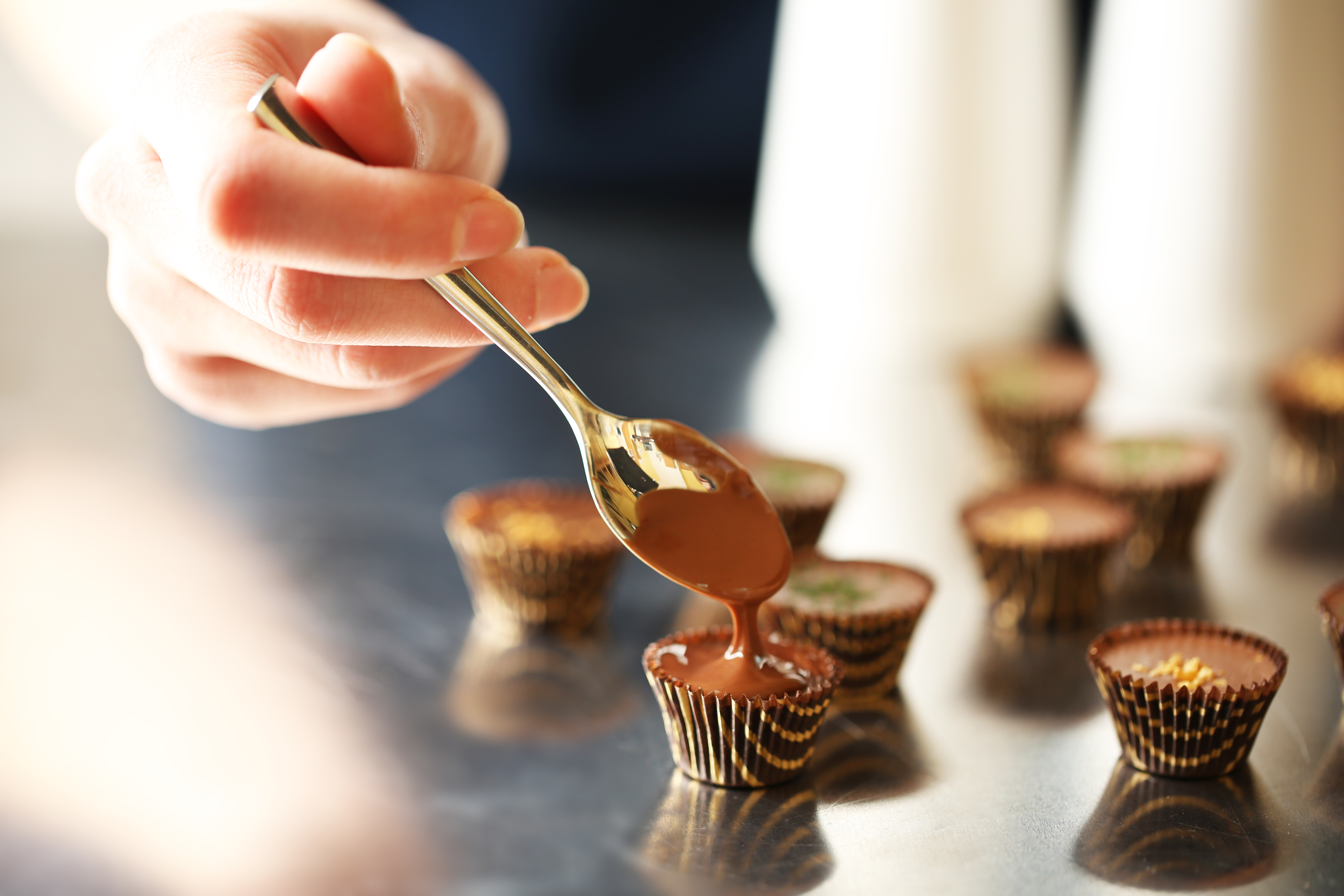 Preparation handmade chocolate candies, close up