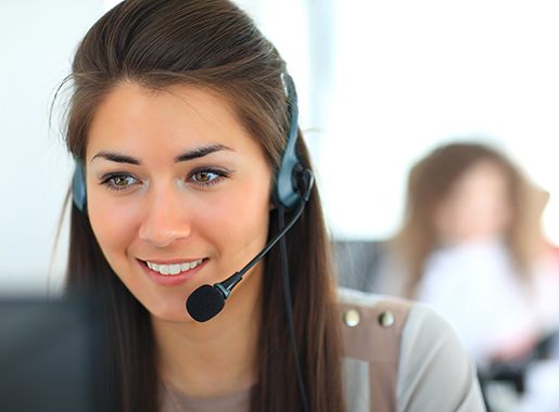 Female customer support operator with headset and smiling