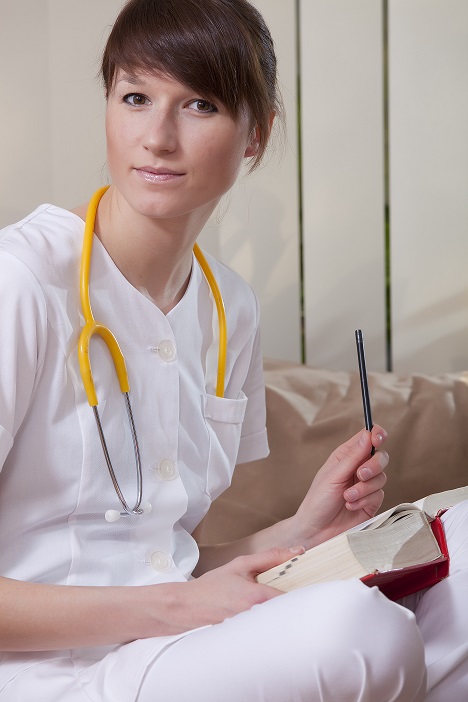 portrait of female medical student with a book